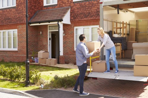 Local moving truck loading furniture for a Barnet property