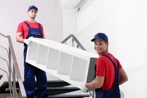 Movers carrying furniture into a Barnet property with care