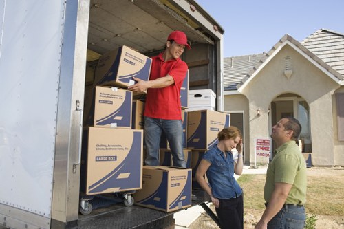 Packed moving boxes and furniture ready for transport in Barnet