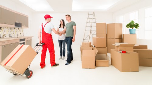 Professional movers packing boxes for a Barnet relocation