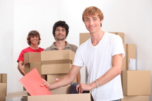 Specialist movers securing a piano for safe transport in Barnet