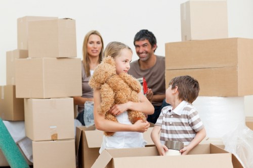 A moving team wrapping fragile household items during packing and unpacking services